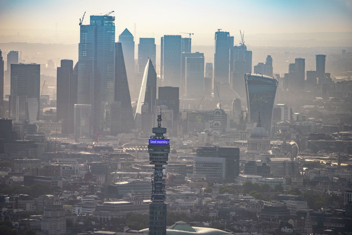 Aerial view of BT, with City of London and Canary Wharf in background, London. 412129