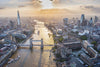 Sunset aerial view of Tower Bridge, River Thames, Shard and the City of London, London. 1969