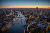 Dusk aerial view taken from a helicopter of River Thames, Tower Bridge, London.